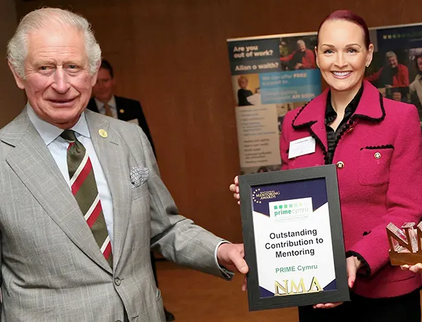 King Charles III being awarded for 'Outstanding Contribution to Mentoring' for the mentoring charity His Majesty founded